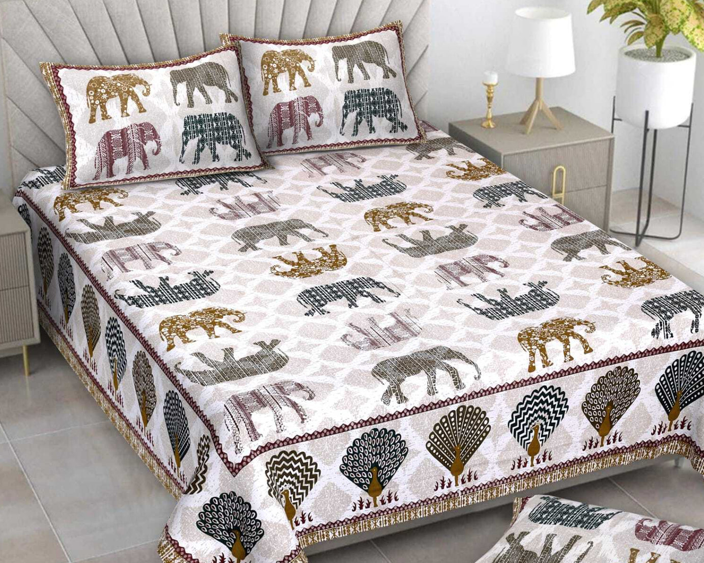 Bedspread set with elephant pattern on a bed in a bedroom setting