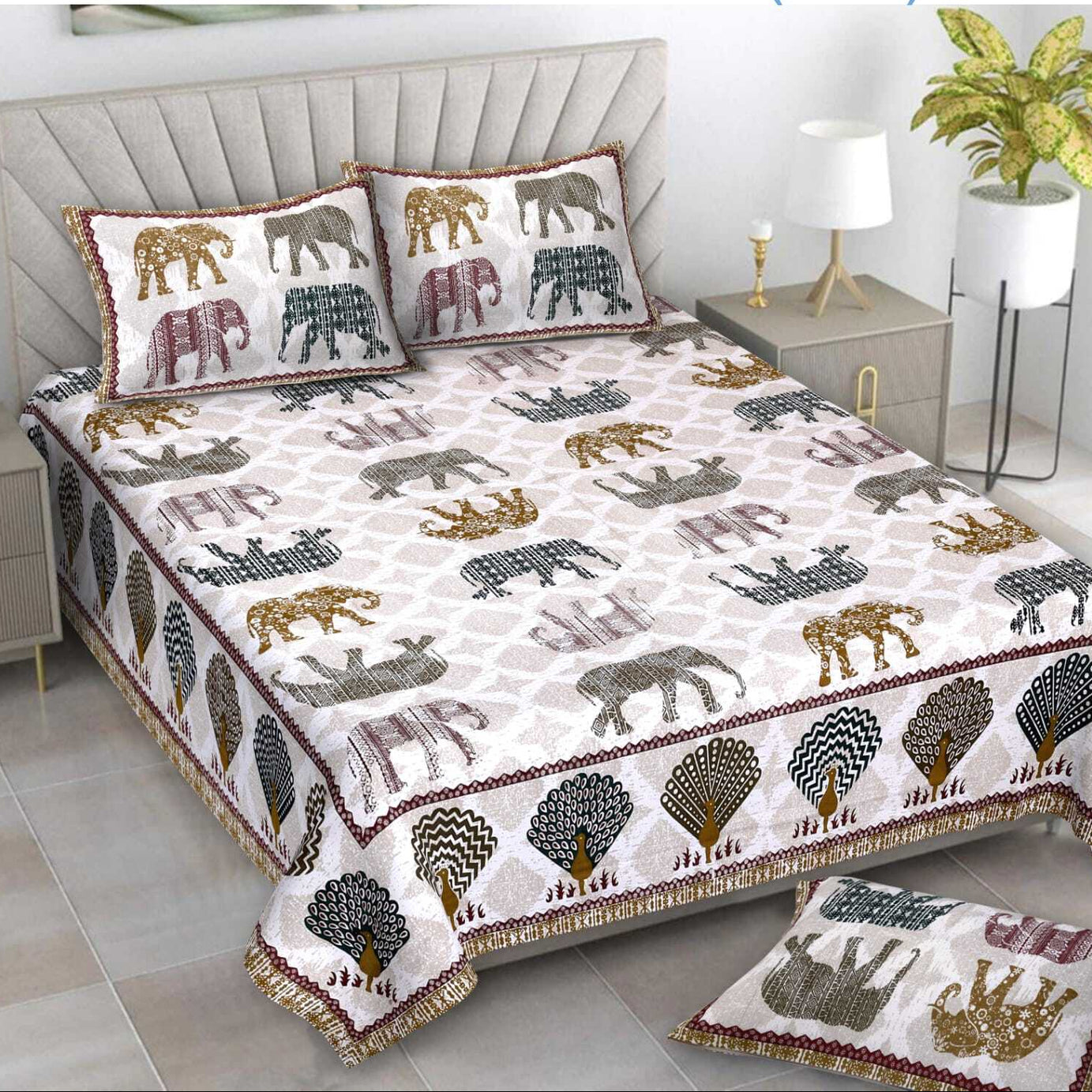 Bedspread set with elephant pattern on a bed in a bedroom setting