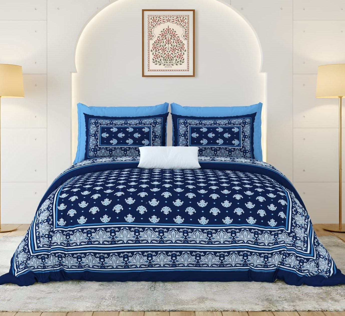 Navy and white patterned bedding set on a bed with a white headboard.