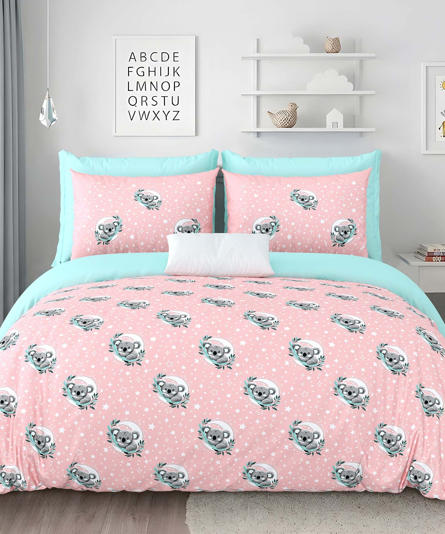 Pink bedspread with koala design in a bedroom setting