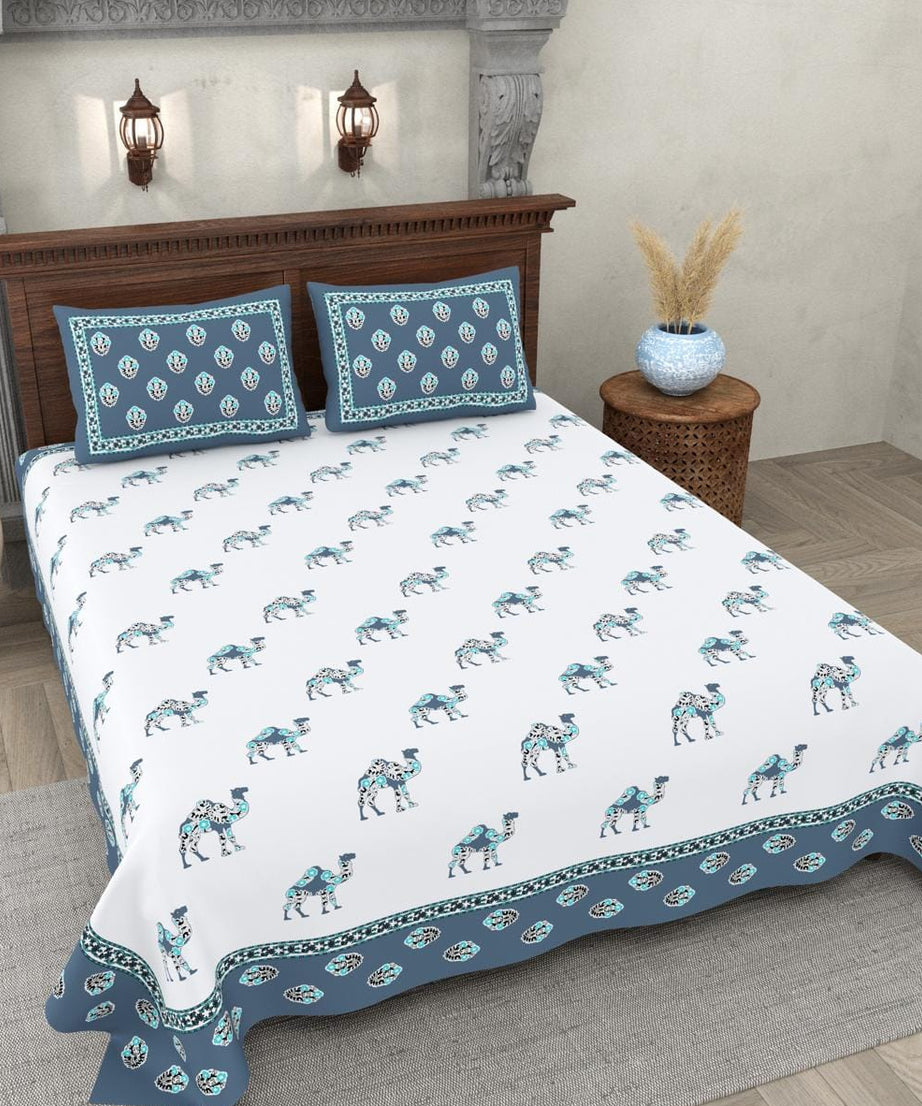 Bed with camel patterned bedding in a bedroom setting